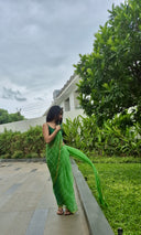 Green chiffon leheriya saree with gold border, model posing outdoors Full
